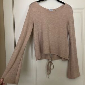 Tan long sleeve top with a cross tie back
